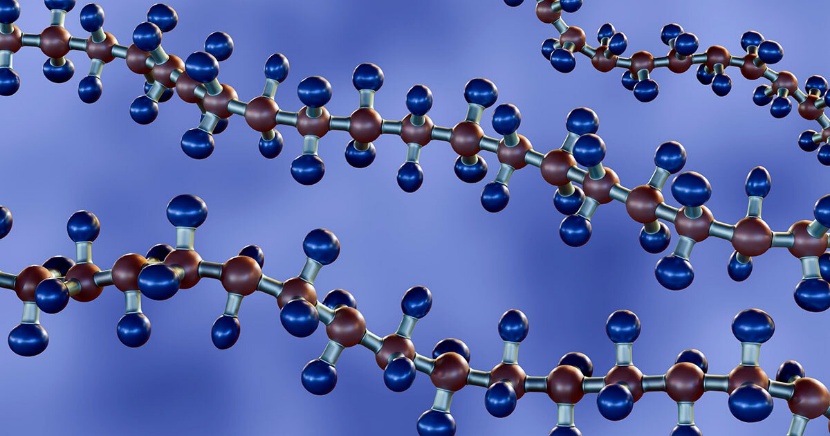 Trois longues chaînes d'atomes, carbones sombres et hydrogènes bleus, sur fond violet
